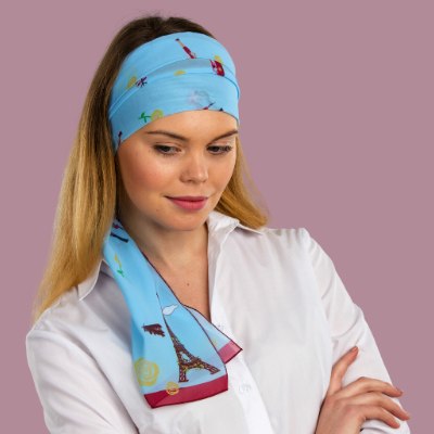 Woman wearing a scarf folded as a head band 