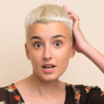 Woman who is surprised with her new short hair