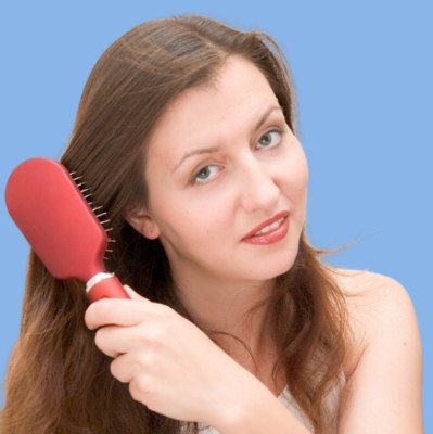 Woman with a hair brush