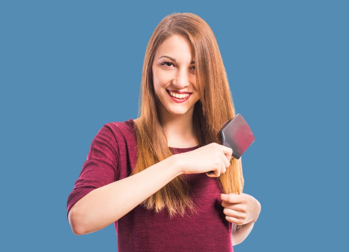 Girl brushing her long hair