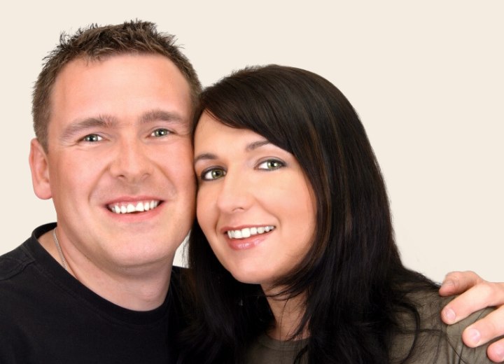 Happy couple with the woman wearing her hair long