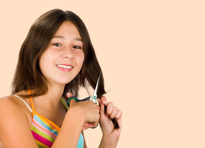 Girl cutting her own hair