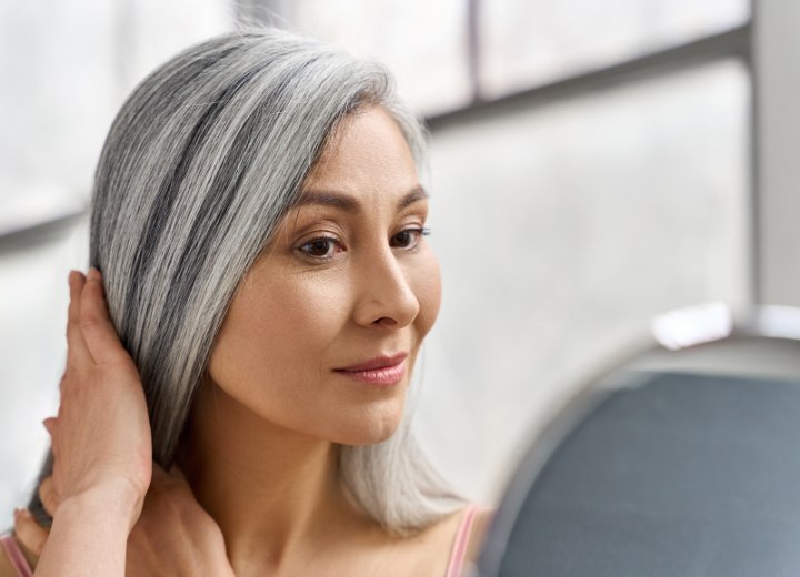 Senior woman with long gray hair