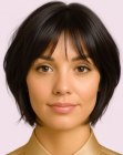 Dark hair cut into a choppy bob