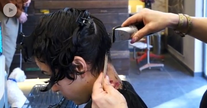 Clipper cutting the nape of a pixie cut