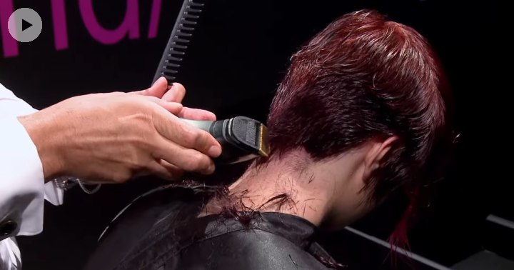 Clipper cutting the neck of a hair model for a pixie cut